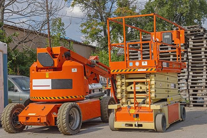 industrial forklift transporting goods in a warehouse setting in Algona